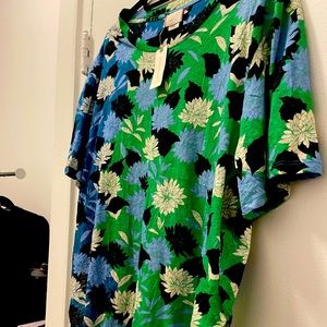 Bright and cheery green, black and white top